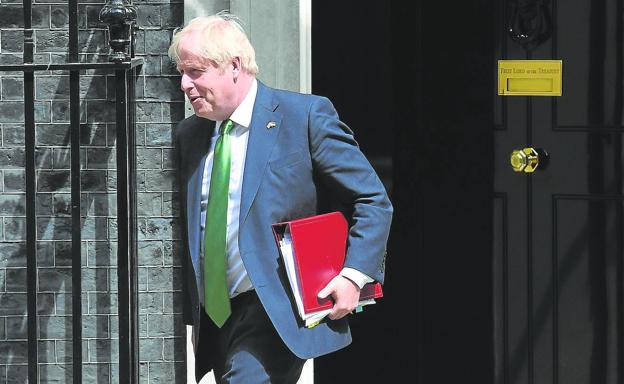 Acting British Prime Minister Boris Johnson leaves 10 Downing Street for Parliament on July 13.